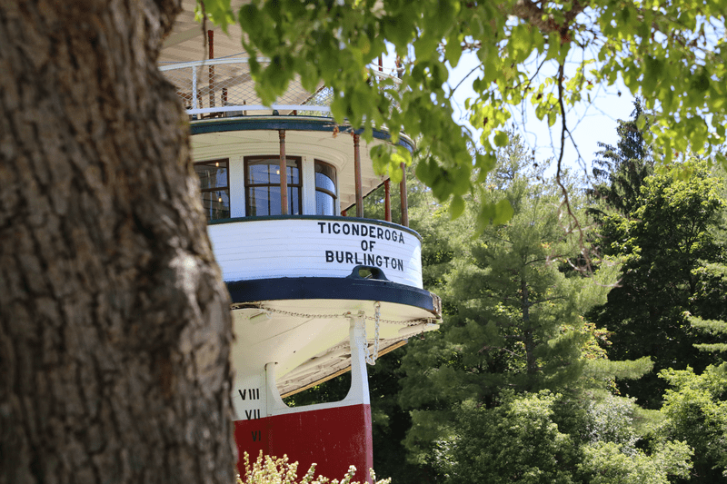 A restored steamship outdoors in the summer.