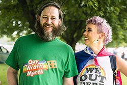 Two people are outside on a warm day.