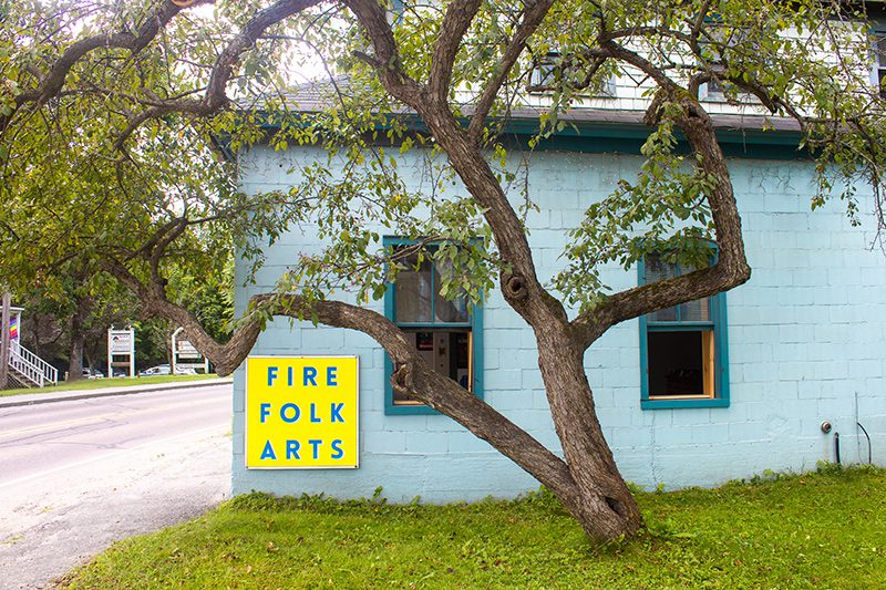 A blue building with a sign reading 