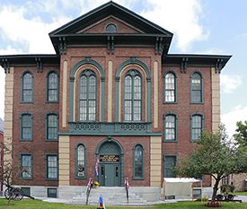 A historic brick building with a sign on the front reading St. Albans Historical Museum.