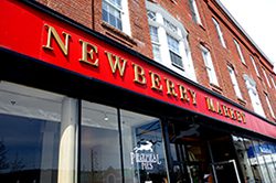 Newberry Market storefront on a historic brick building.